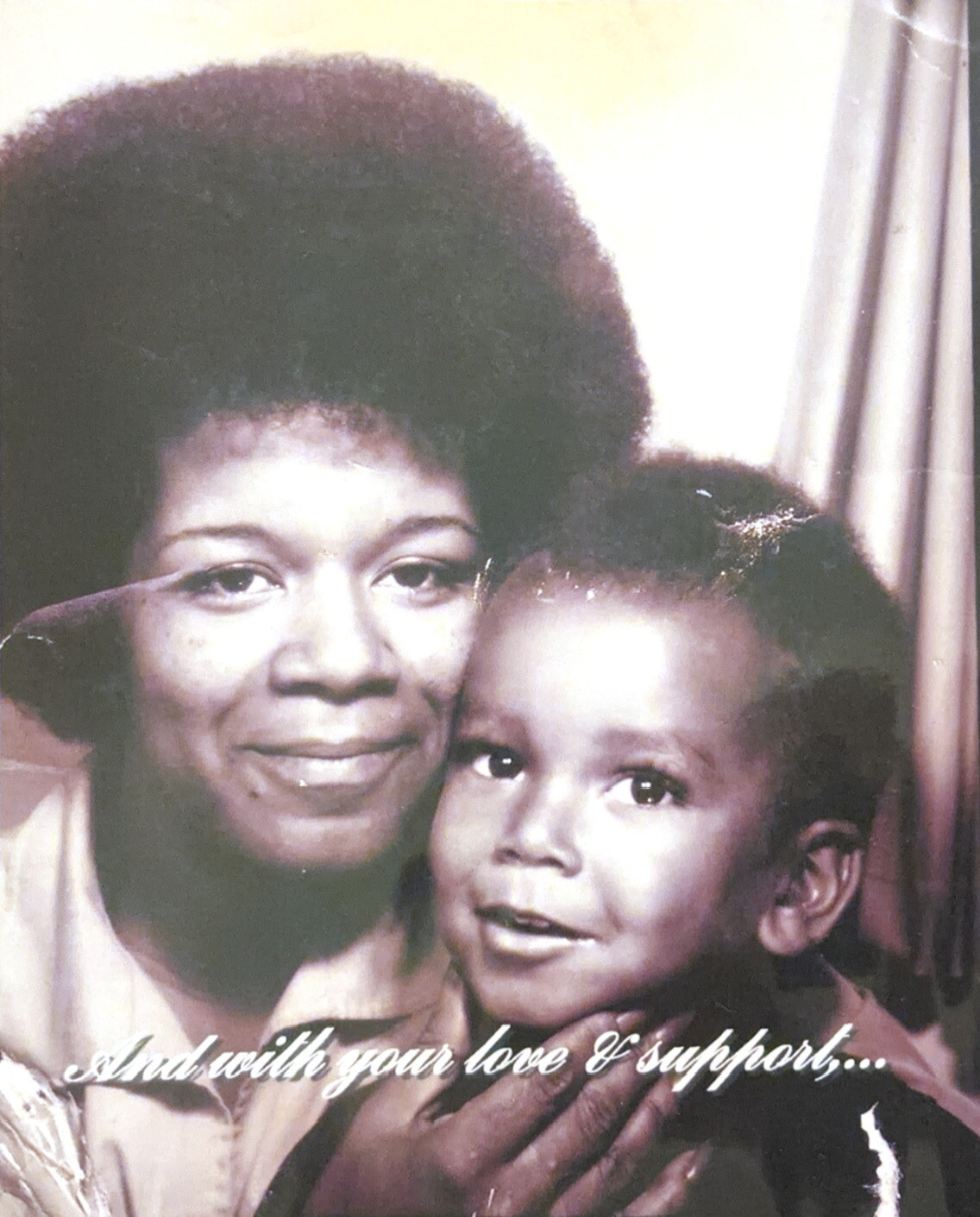 Mother and young child share a close, affectionate pose in a sepia-toned portrait; caption reads ‘And with your love & support…’