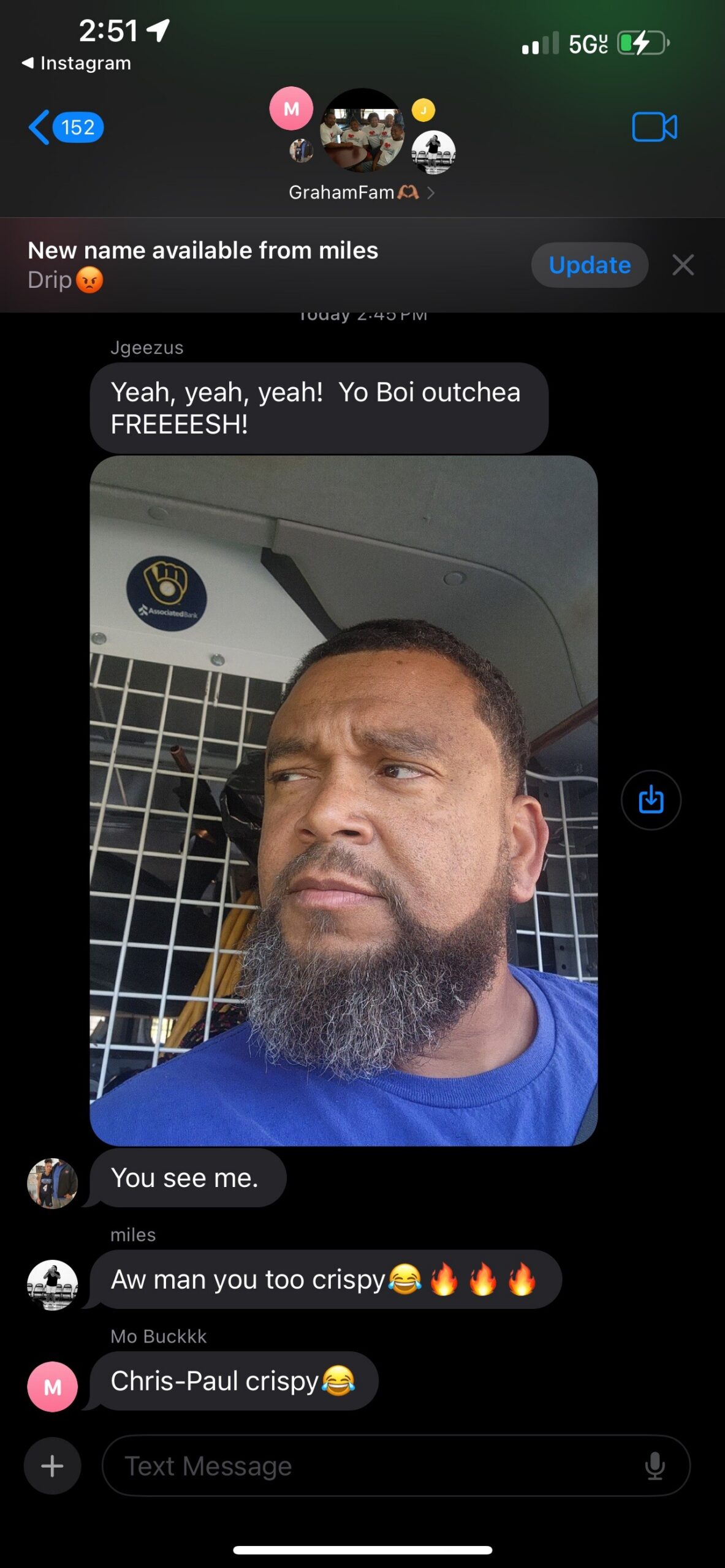 Chat screenshot on a dark iPhone interface: a bearded man in a blue shirt seated in a vehicle is shown in a shared photo, with messages above and below reading 'Yeah, yeah, yeah! Yo Boi outchea FREEESH!' and 'You see me.'