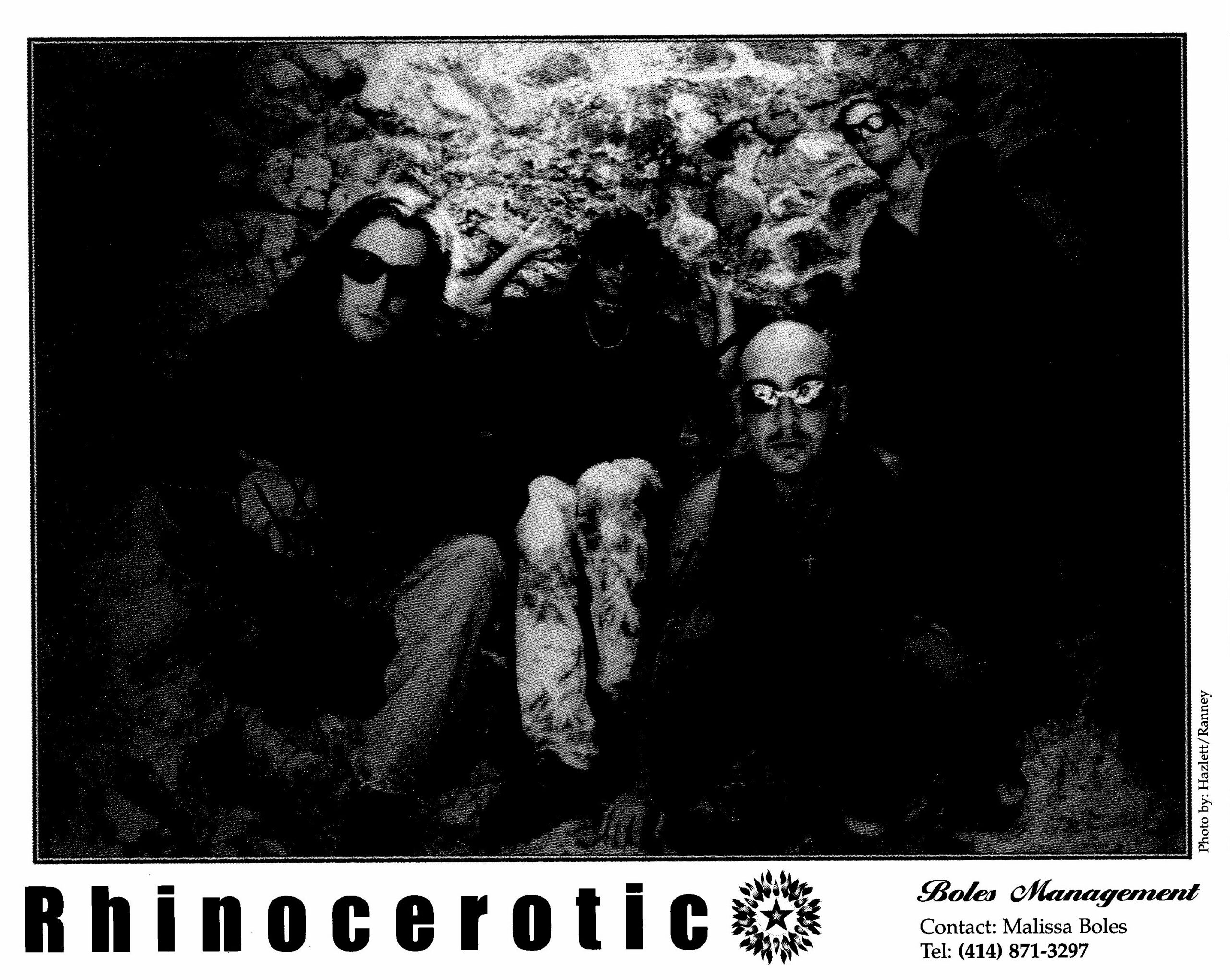 Black-and-white poster showing a group photo in a rocky setting, with bold text at the bottom (appearing to read 'Rhinoscerot' or similar) and contact details along the right edge.