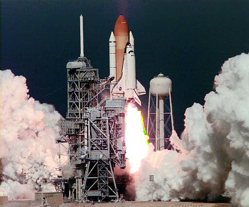 Space Shuttle on a launch pad blasting off with a bright flame plume and surrounding white smoke clouds on a gantry system.