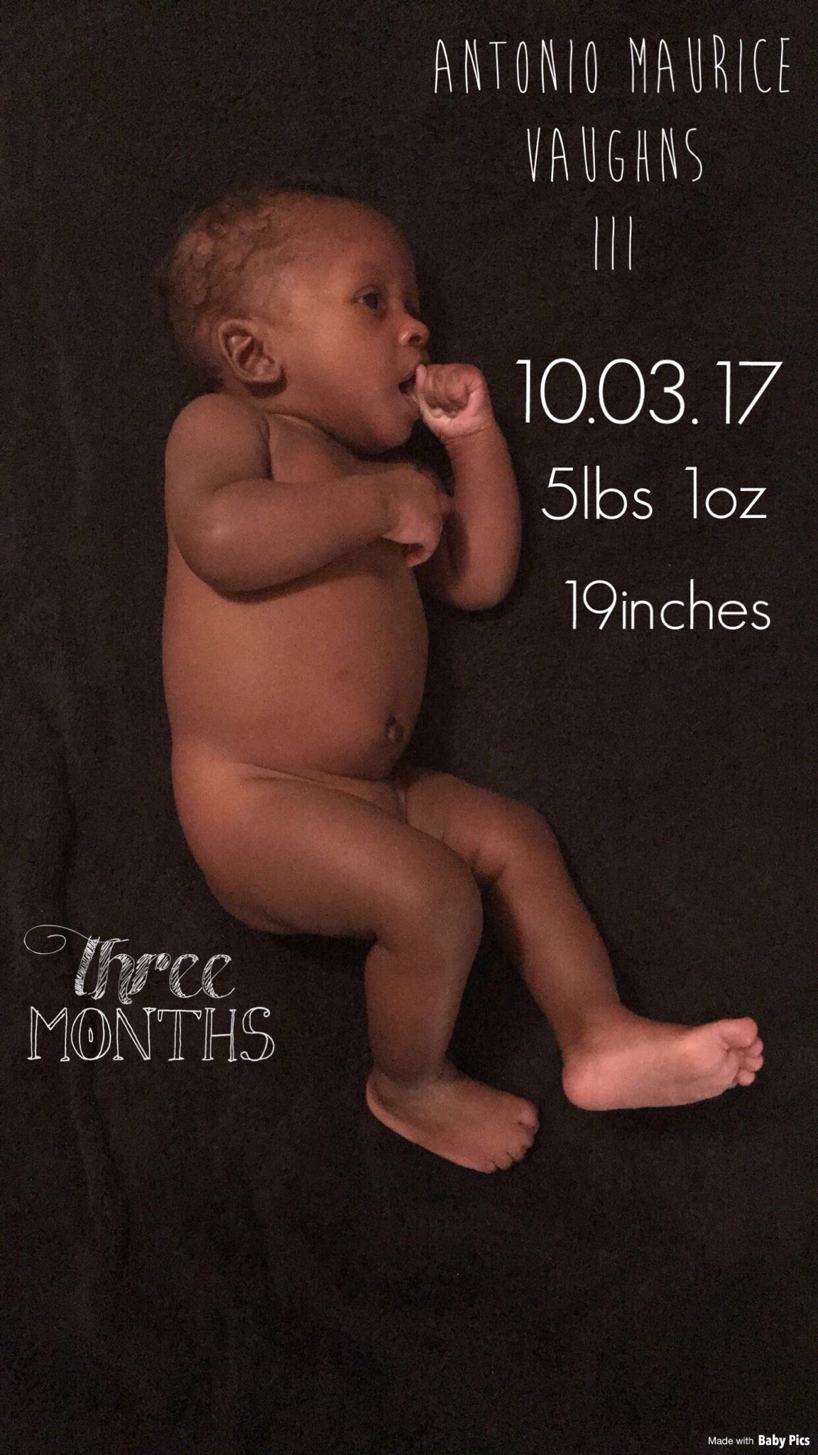 Birth announcement photo of a newborn baby on dark fabric with name Antonio Maurice Vaughans III and birth stats: 10.03.17, 5 lb 1 oz, 19 inches.
