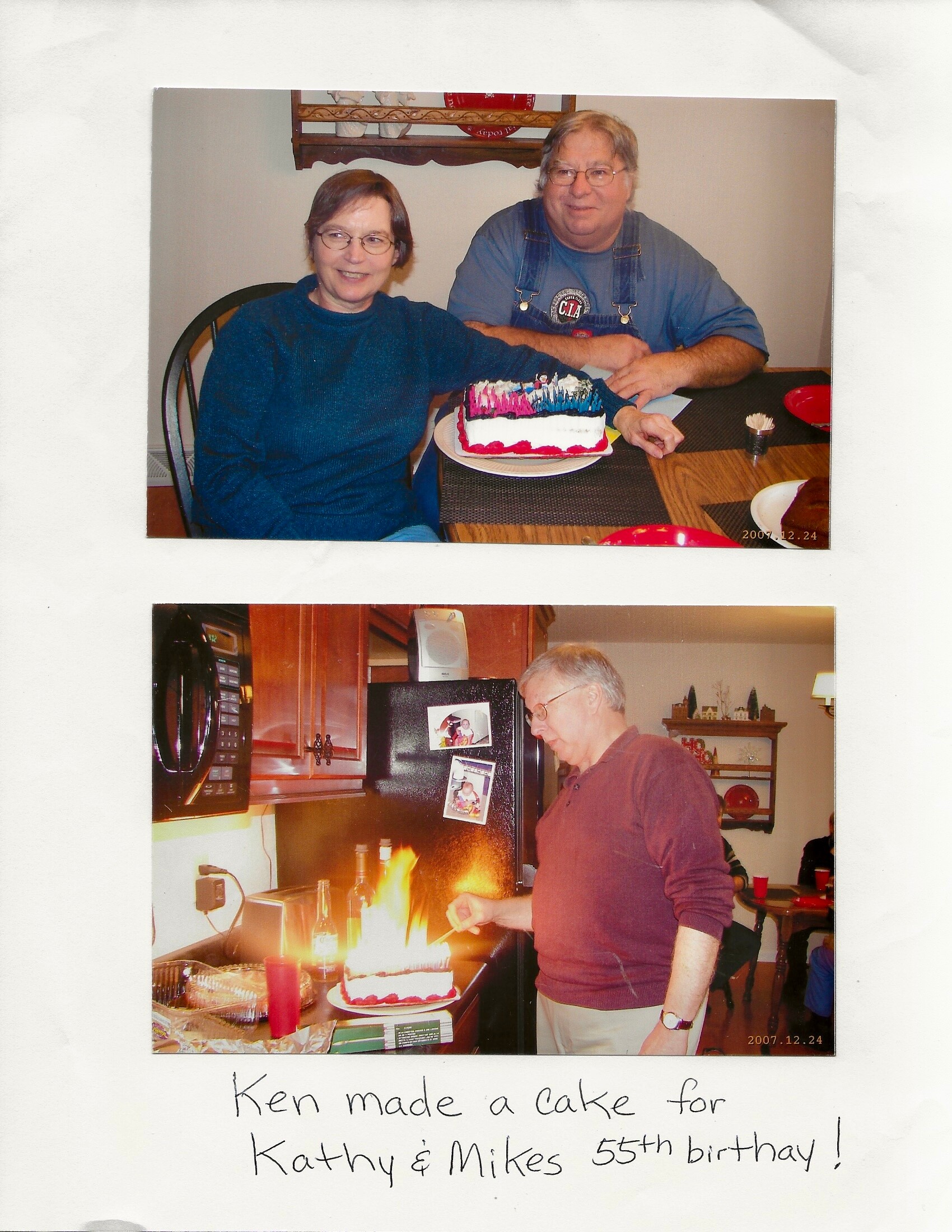 Smiling couple sits at a kitchen table with a decorated rectangular birthday cake on a plate in front of them.