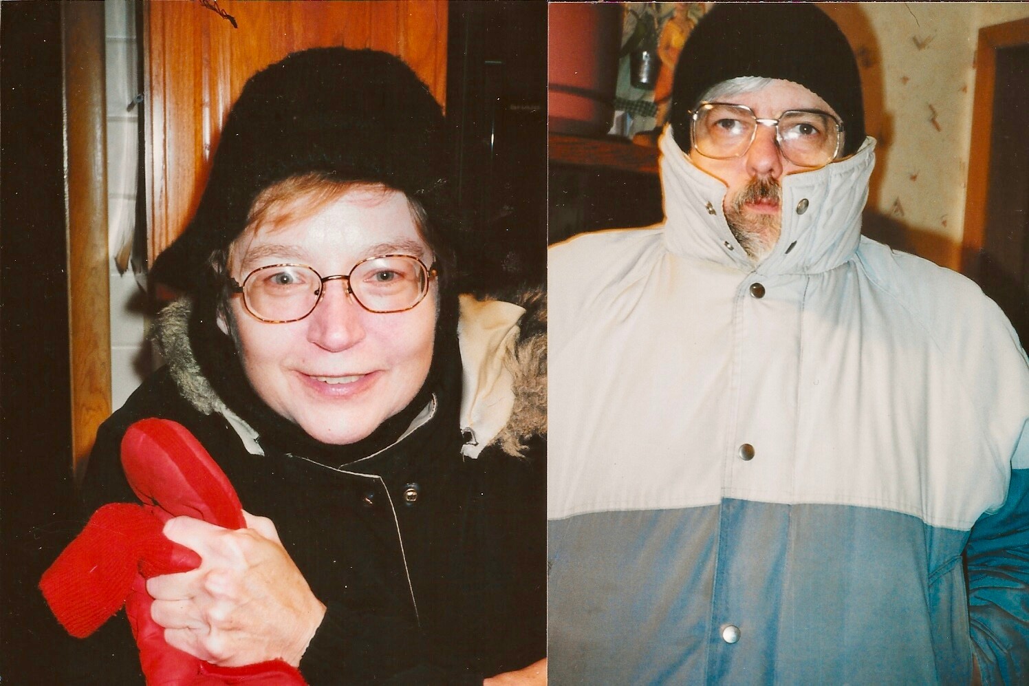 Smiling woman with glasses in a black winter hat holding a red scarf next to a man in a light gray-blue winter coat and black beanie.