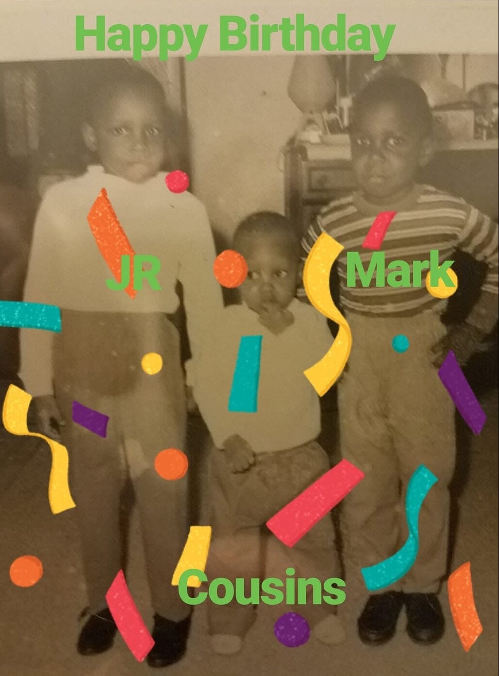 Black-and-white photo of three young cousins posing for a birthday portrait, with bright green captions 'Happy Birthday' and 'Cousins' and the names JR and Mark overlayed with confetti.
