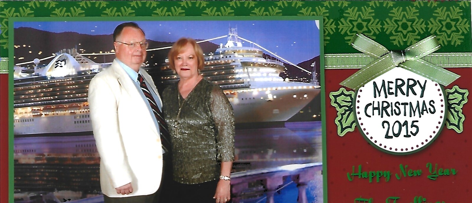 Couple posing in front of a large lit cruise ship at night on a Christmas card backdrop (Merry Christmas 2015).