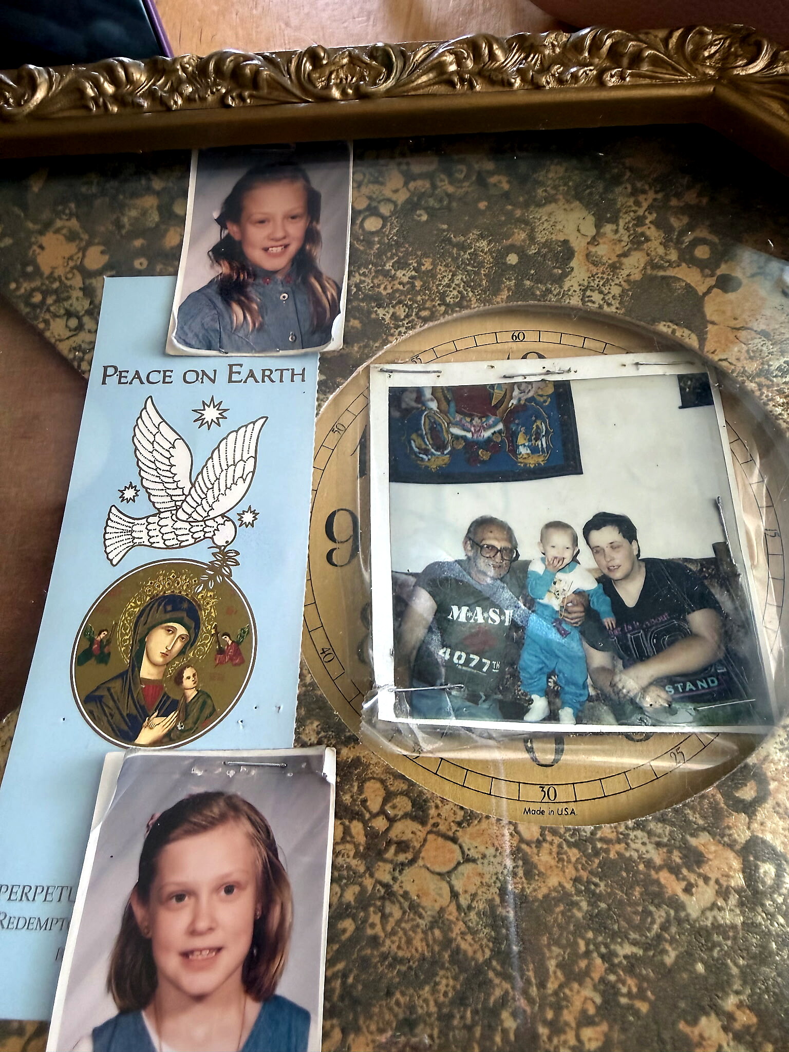 Collage of childhood photos: a girl portrait, a smaller blue 'Peace on Earth' card with a dove, and a group photo, all on a textured surface.