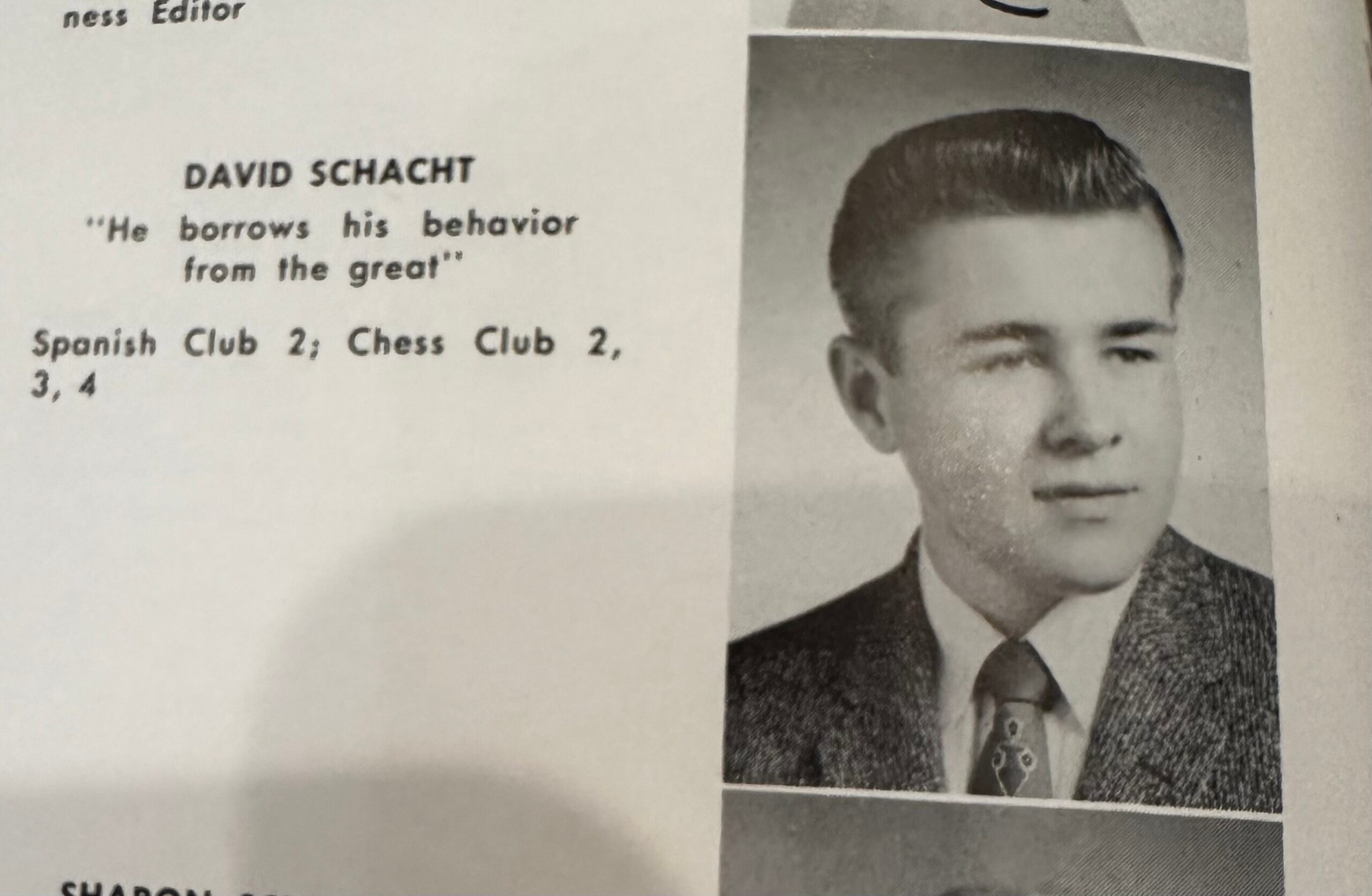 Yearbook headshot of David Schacht in a suit, with the quote 'He borrows his behavior from the great' and club listings visible nearby.