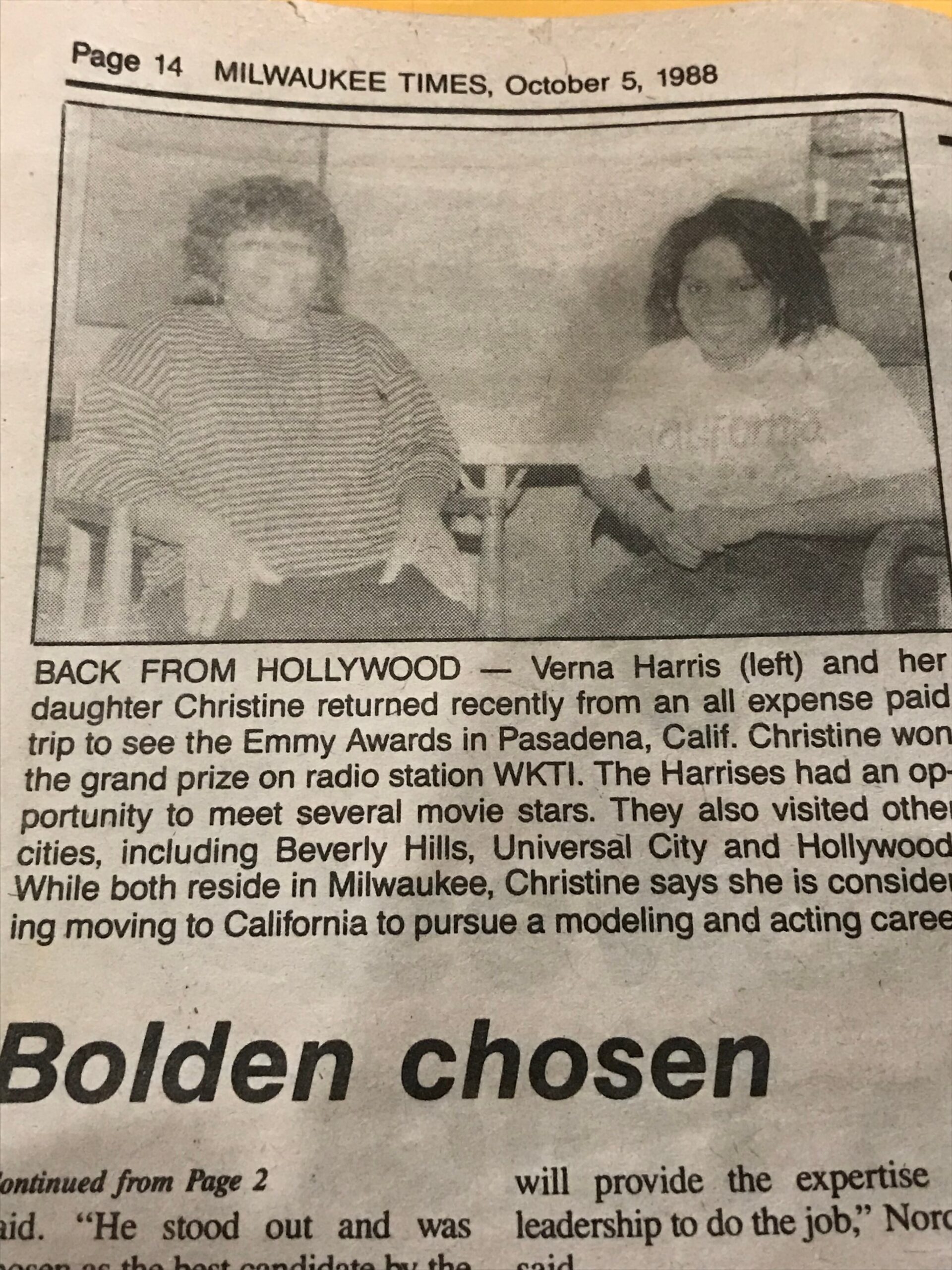 Newspaper photo of two women sitting side by side; caption identifies Verna Harris (left) and her daughter Christine, back from Hollywood for an Emmy Awards trip.