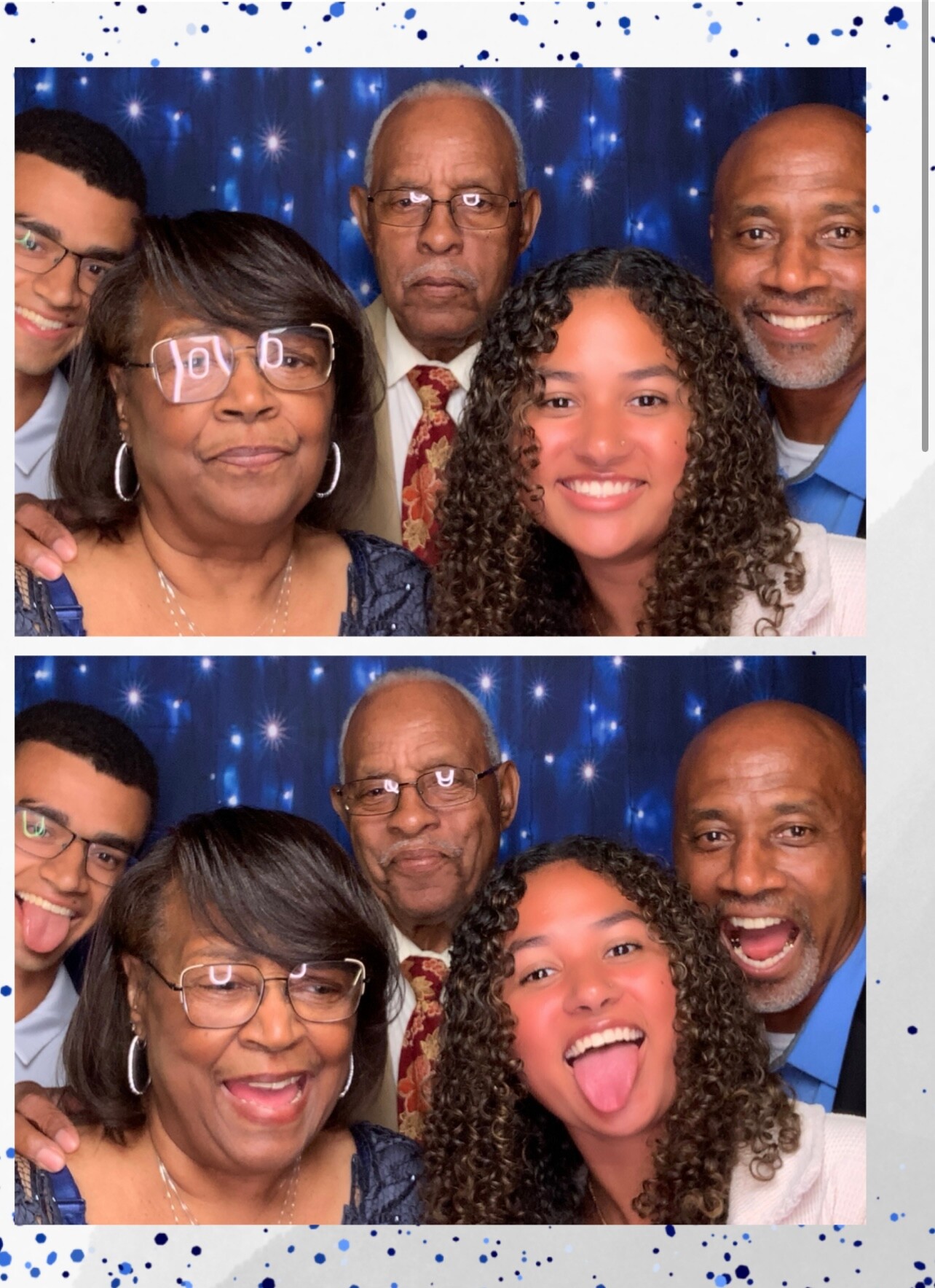Group selfie of five smiling people posing close together in front of a blue starry backdrop. Central older man wearing glasses and suit; others include an older woman with glasses, a young woman with curly hair, and two men on either side.