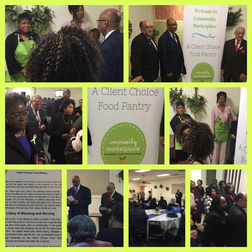 Group of attendees and organizers at a 'A Client Choice Food Pantry' community marketplace event with a green apron in the foreground and banner in the background, indoors. (informative)